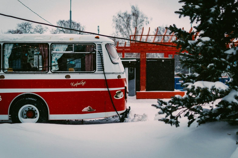 a bus parked in the snow with people inside