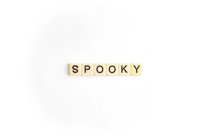 a word made out of letter blocks spelling spooky