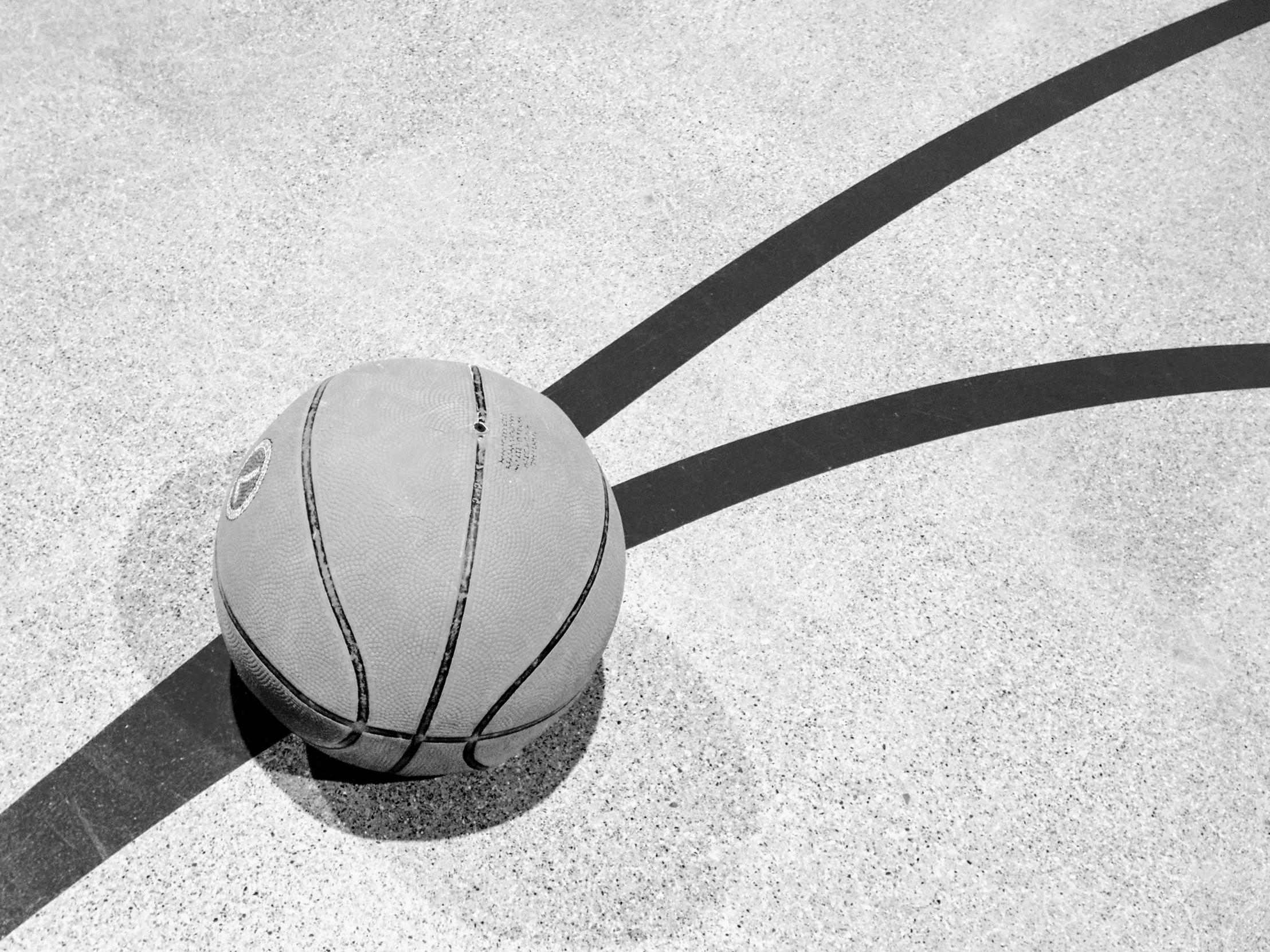 an overhead view of a basketball on the ground