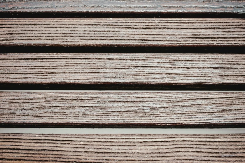 some brown wood planks lined up side by side