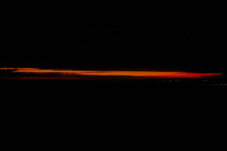 the sky with clouds in it and dark background