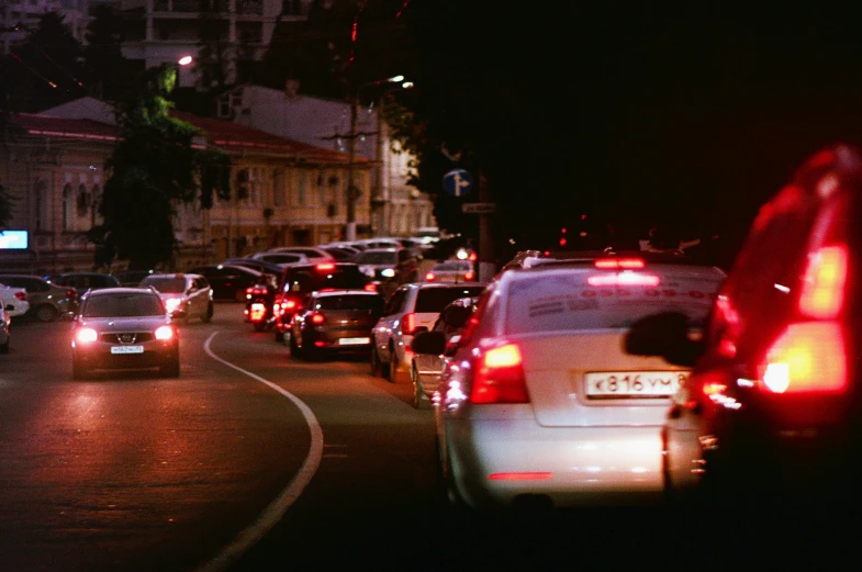 a large long traffic filled road with lots of cars