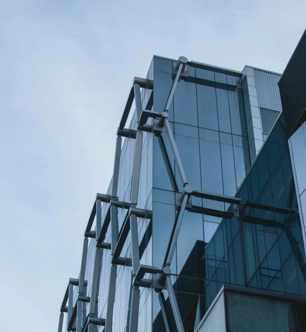 modern building reflecting its surrounding glass