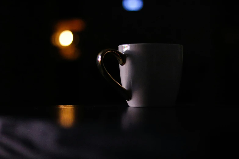 a coffee cup sitting on top of a table