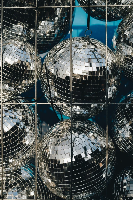 mirrors reflecting disco ball patterns of different sizes