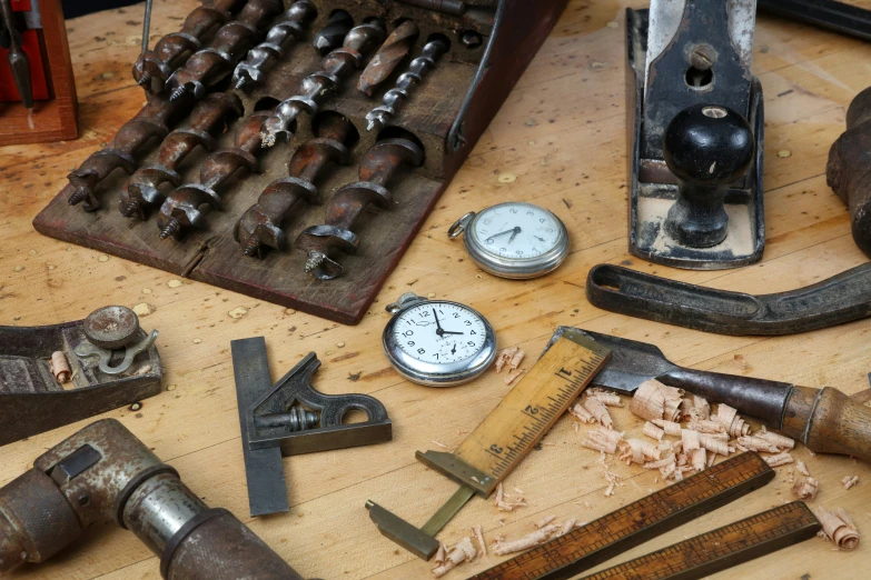 old tools used to work on a wooden table