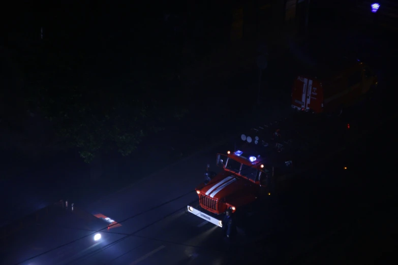 a truck at night driving through the dark