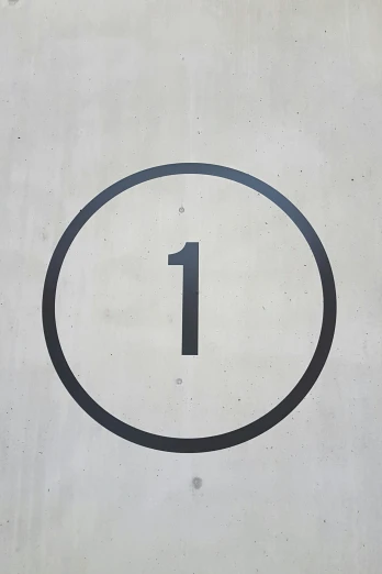 a close up of a number one sign with a red circle on it