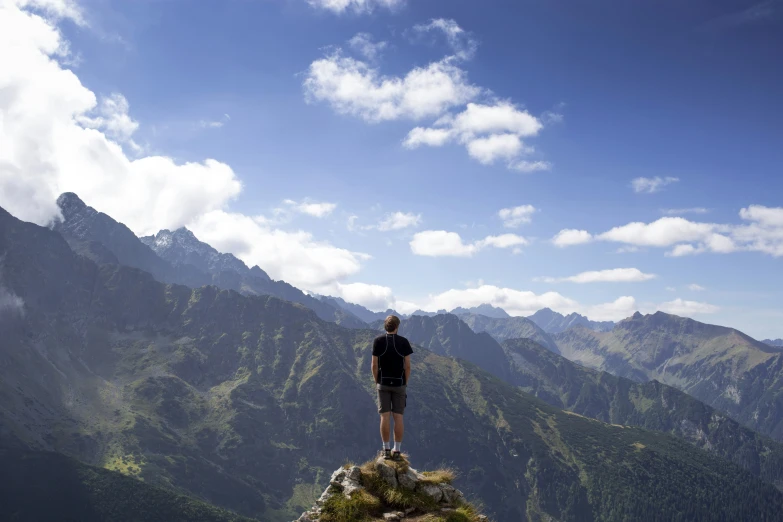 a man standing on top of a rocky mountain