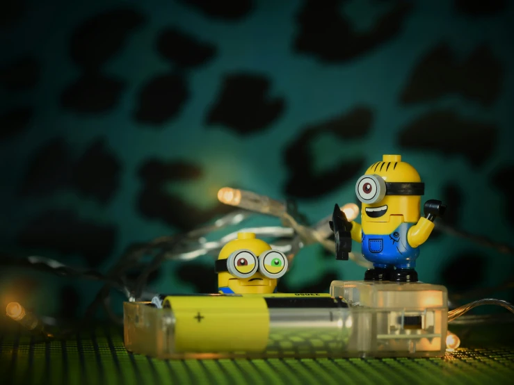 a couple of minions with lights attached to them