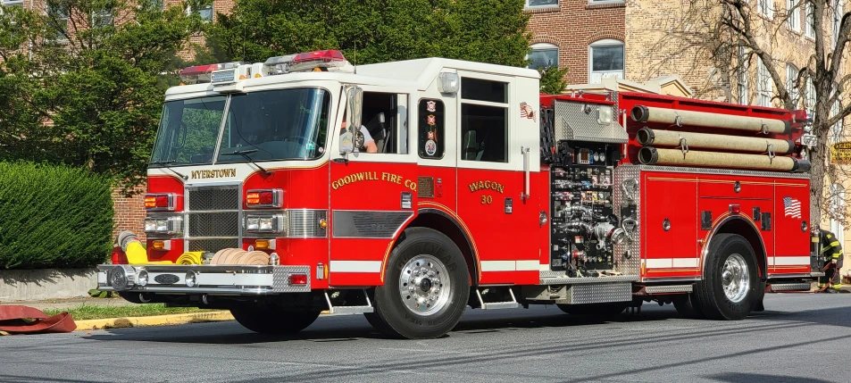 a fire truck sitting on the side of a road