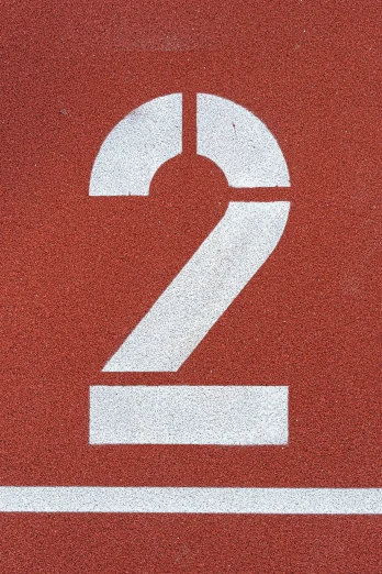 a number 2 sign is displayed on the side of a wall