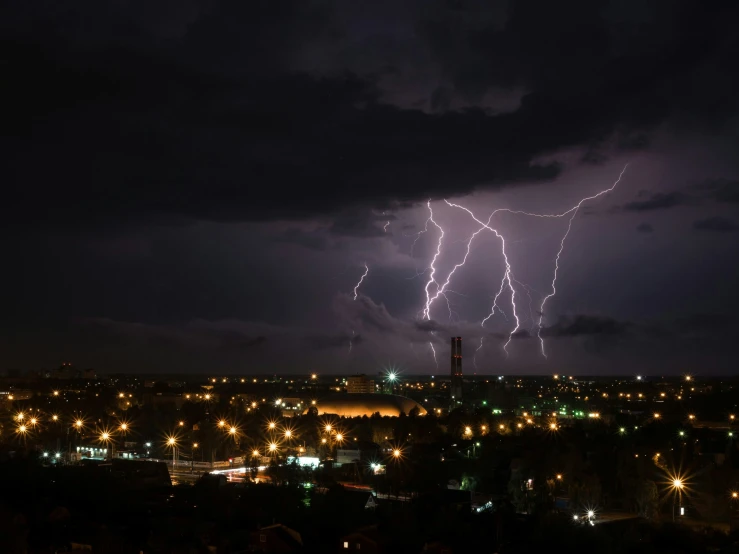 a lightning bolt on a dark night in the city