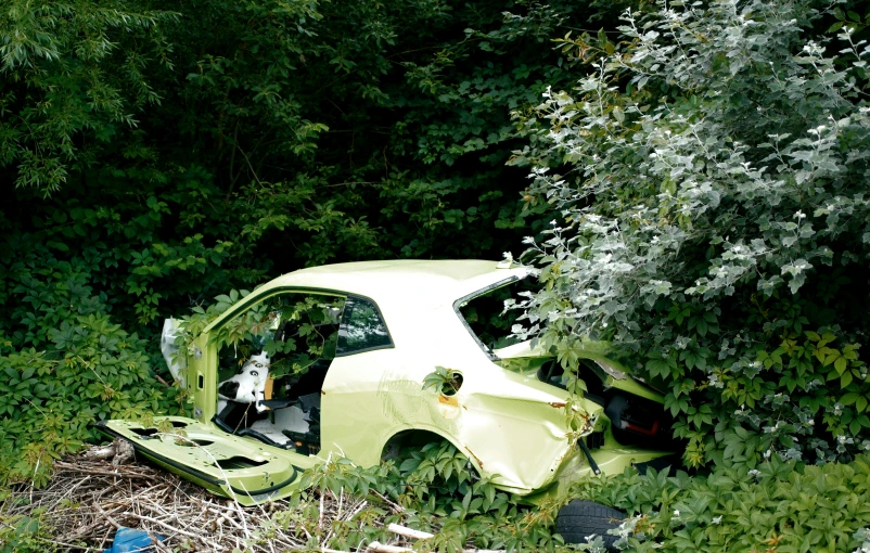 a car that has been flipped over on the side of the road