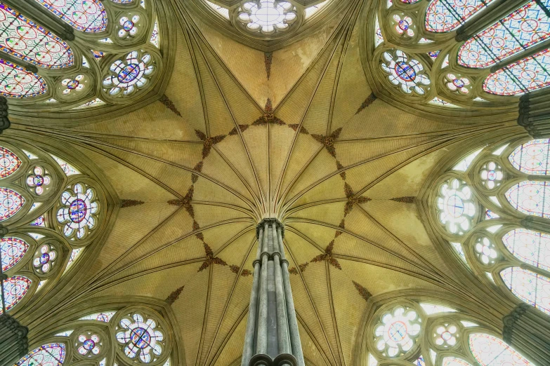 looking up at the high vaulted windows inside a church