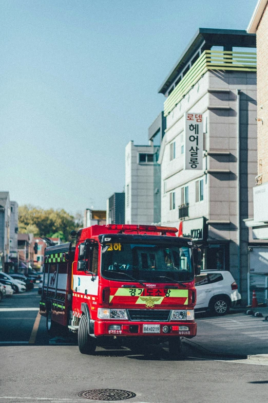 a firetruck that is going down the street