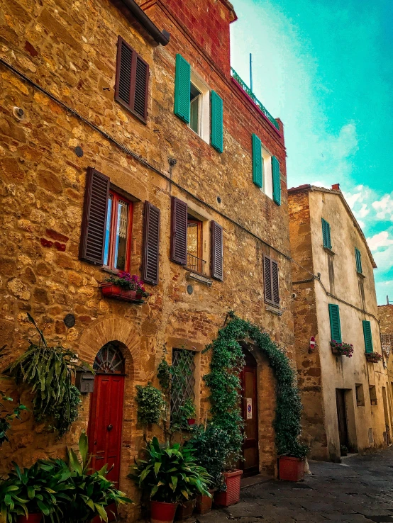 the cobblestone streets in an italian town are full of windows