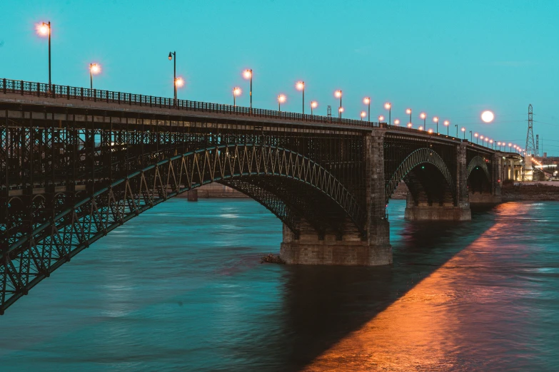 the bridge with lots of lights above it on a night