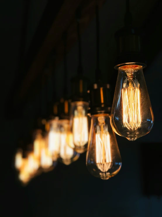 a group of small light bulbs are suspended above