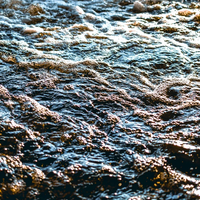 very bright blue water with small white bubbles