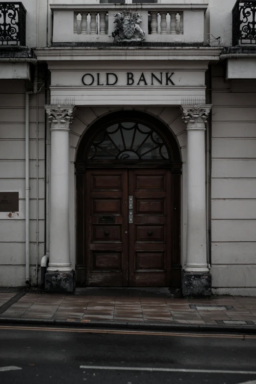 two red fire hydrants and an old bank