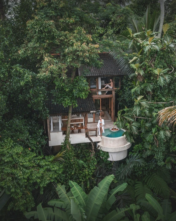 a person stands on the porch of a boat