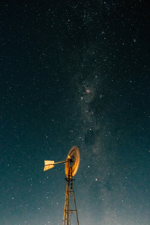 a radio tower with a satellite dish next to it