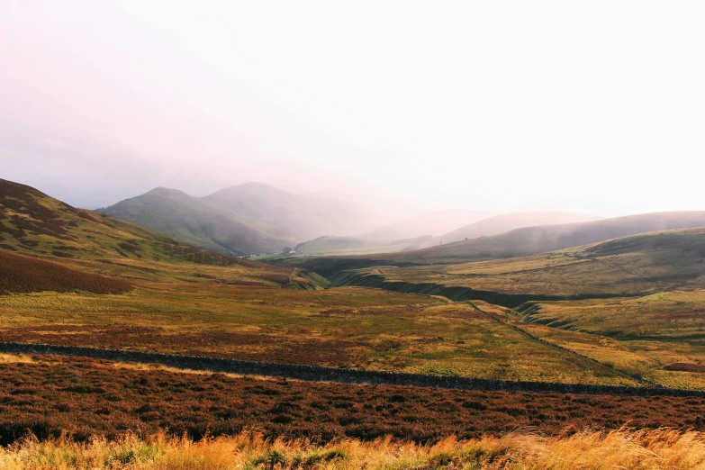 a scenic mountain range with rolling hills