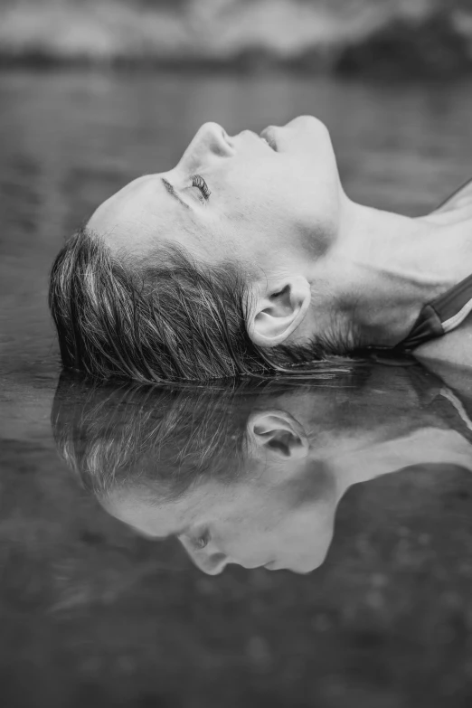 a man is submerged in the water during the day