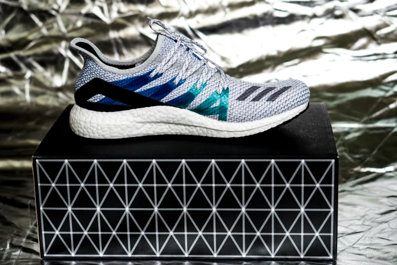 the adidas ultraboost running shoe is shown in grey and blue