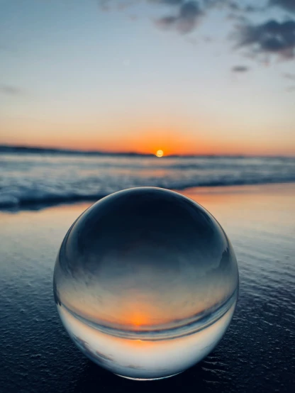 an crystal ball at sunset on the beach