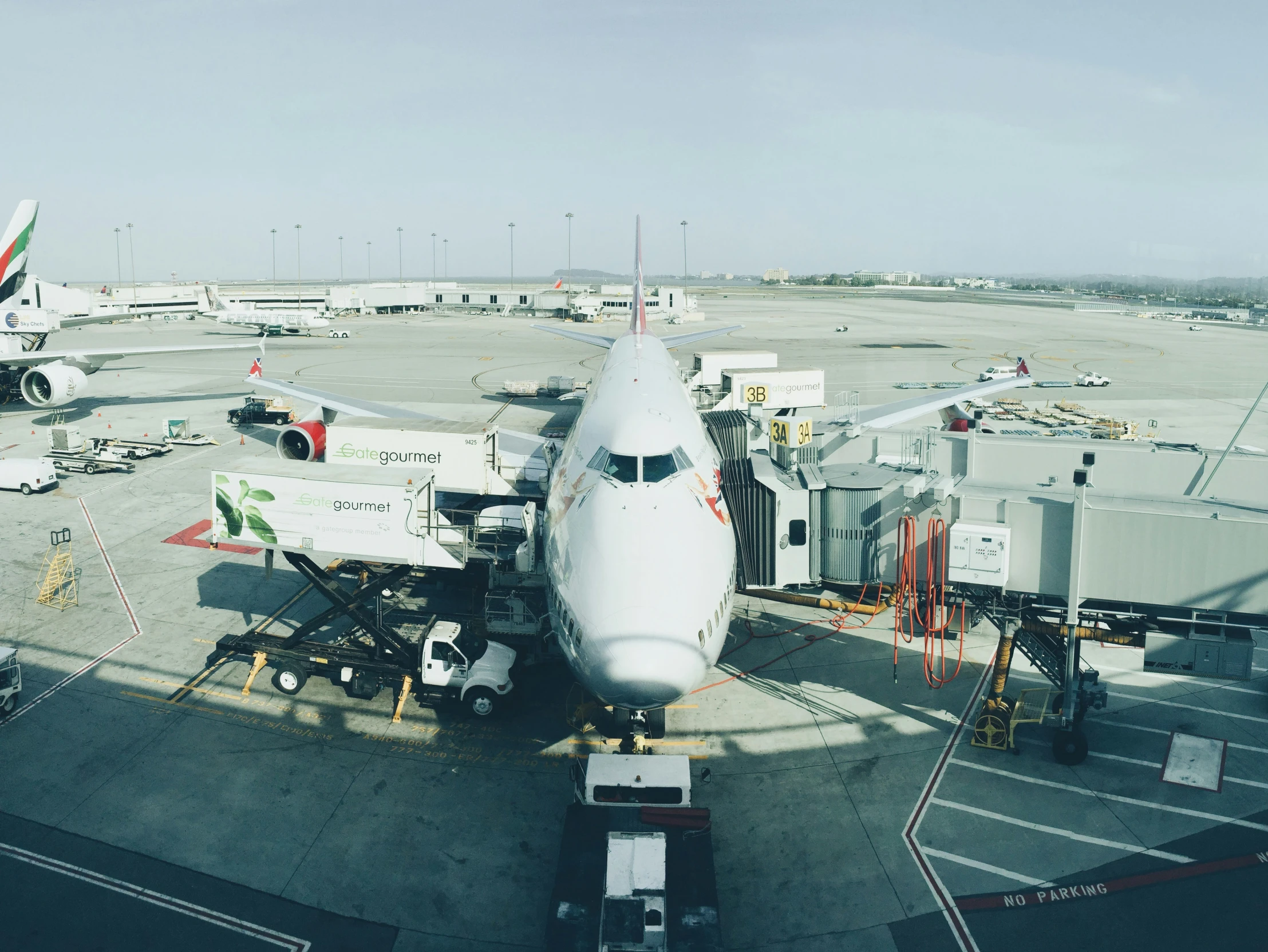 an airplane parked at the gate at the airport