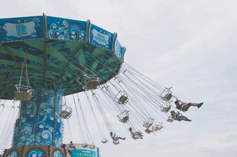 a carnival ride is shown against the sky