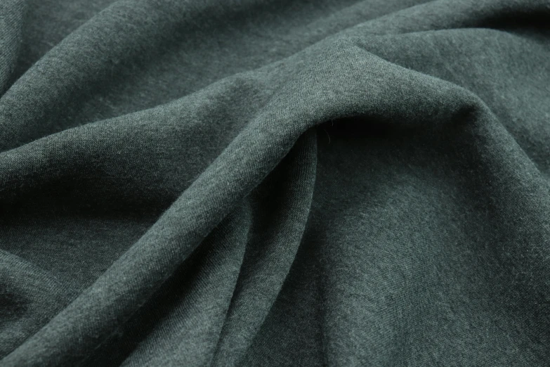 the back side of a green fabric with dark grey stripes