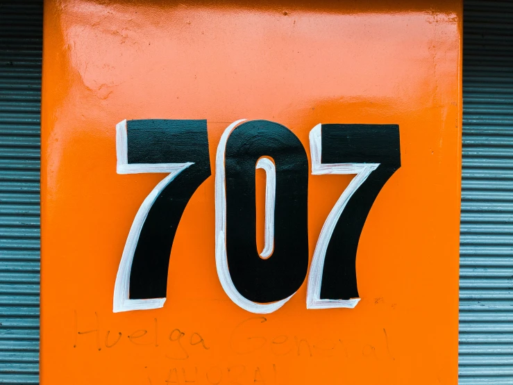 an orange and black number seventy painted on it