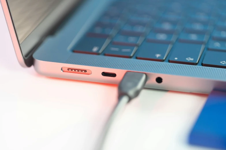 an open laptop on a table with a mouse