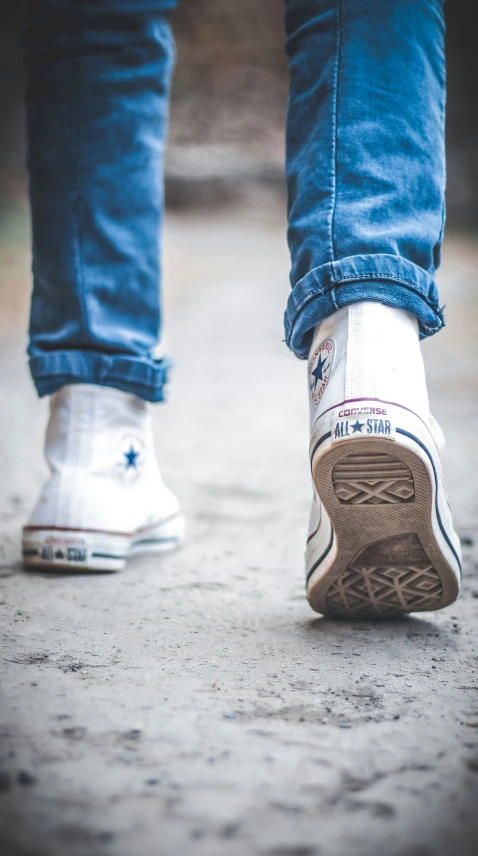 the legs and bottom end of an upper body man's shoes