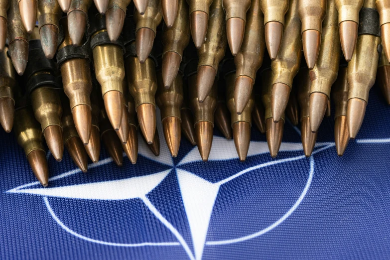 a bunch of bullet heads sitting on top of a blue cloth