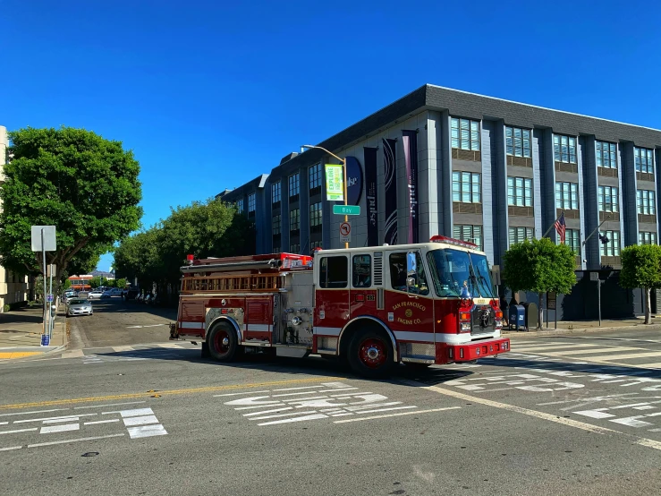 the firetruck is traveling down the city street