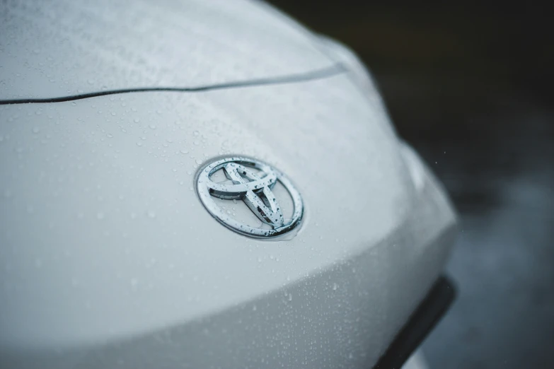 a toyota logo is pictured on the hood of a car