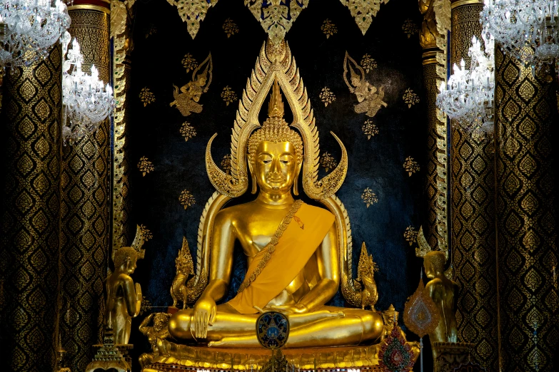 a golden buddha statue in the center of a room