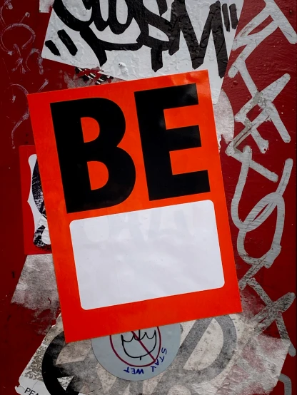 a sign is posted against a red and black background