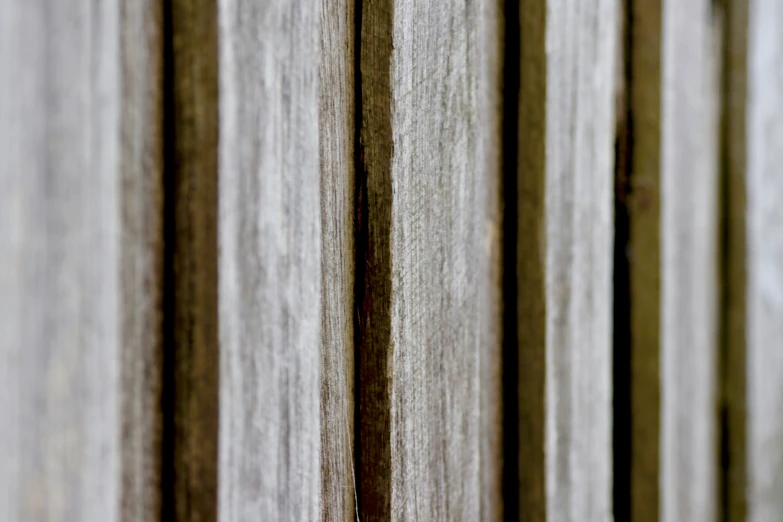 a wood panel wall has different thin, wavy wooden strips