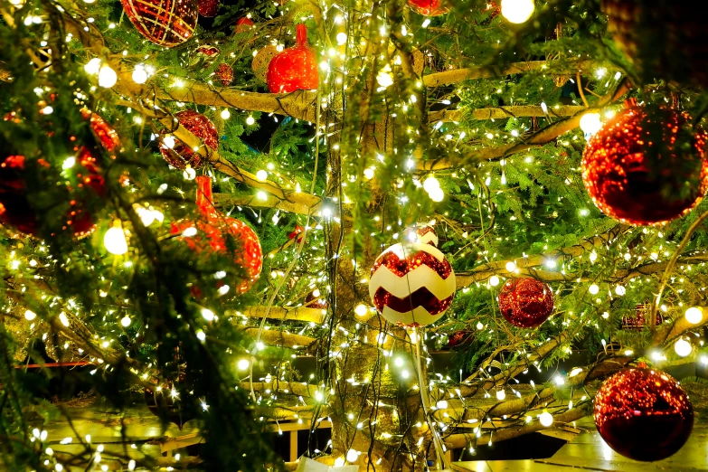 a large christmas tree with an assortment of decorations