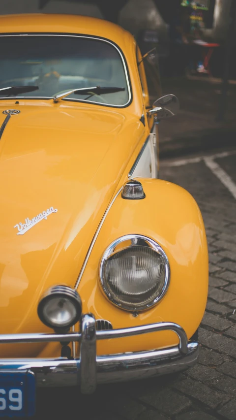 a yellow car is parked in front of a building