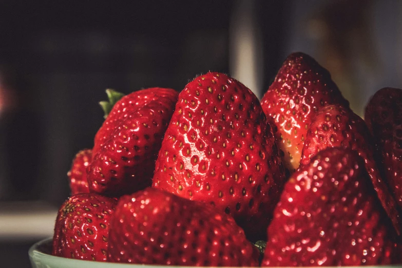 a bunch of strawberries are in a bowl