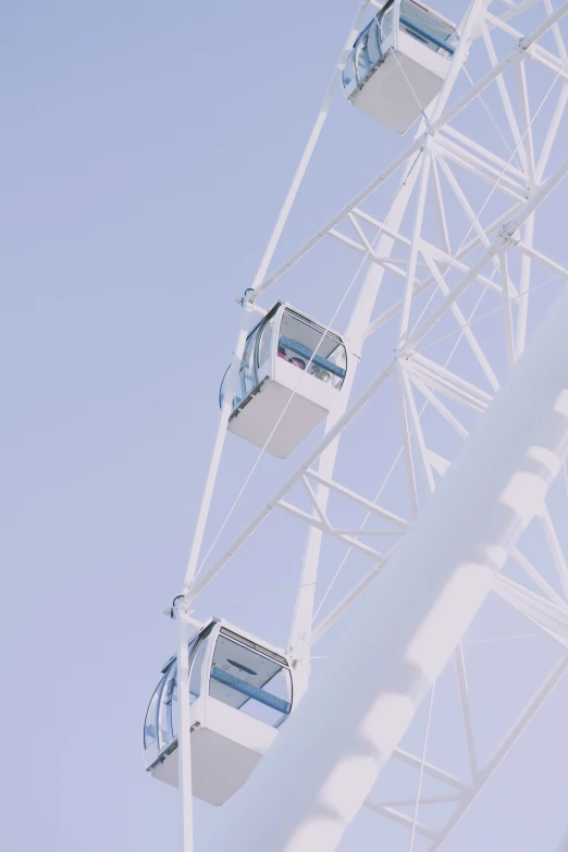 the blue and white ferris wheel is in motion