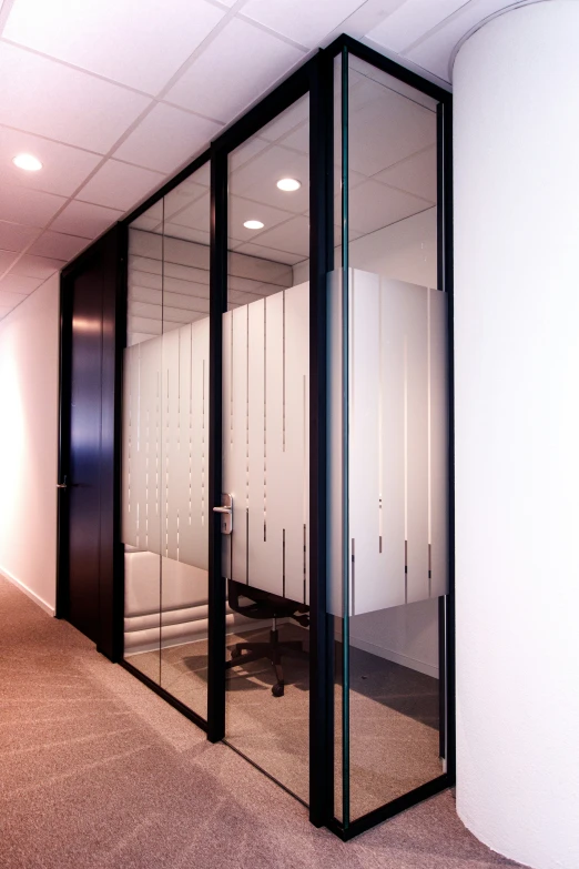 the view through an office door of a empty cubicle