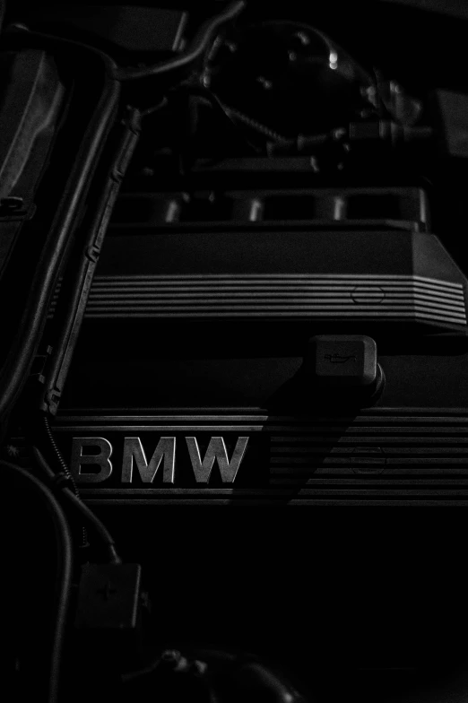 a bmw car engine with its lights on