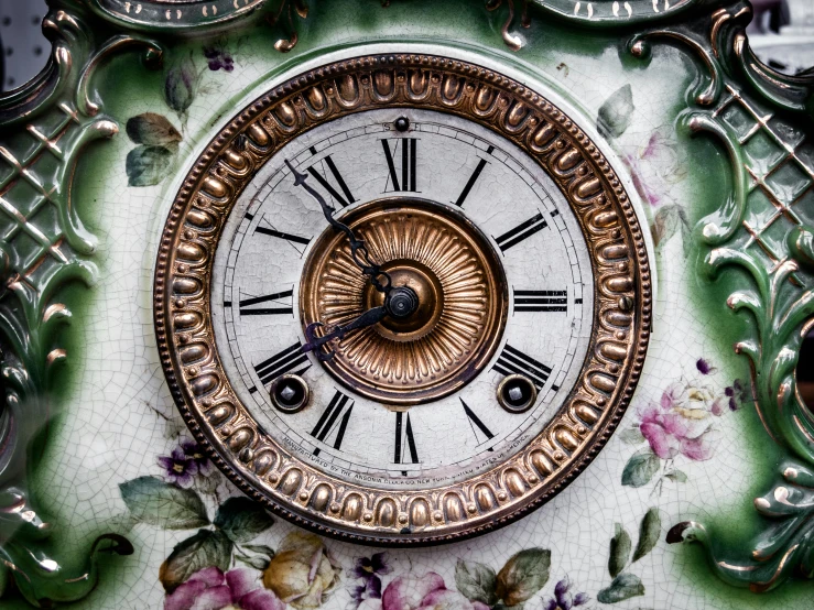 an ornate clock with ornate floral decoration